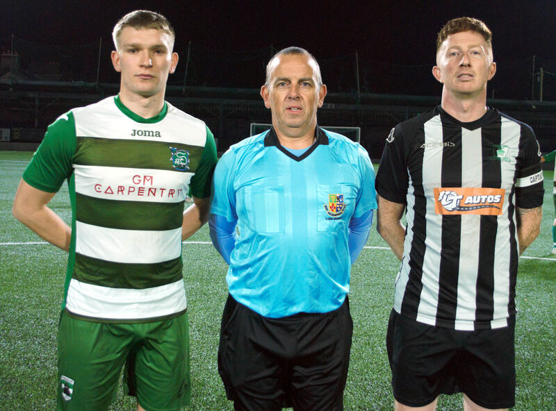 Springfield's captain Caylum Geaney (left), with Knocknaheeny Celtic's Wayne O'Leary, accompanied by referee Stephen Moore.