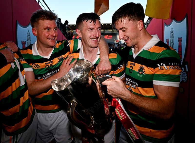 Cup of joy for Patrick Horgan, centre, David Dooling and Simon Kennefick as they hold the Seán Óg Murphy cannister. Picture: Seb Daly/Sportsfile