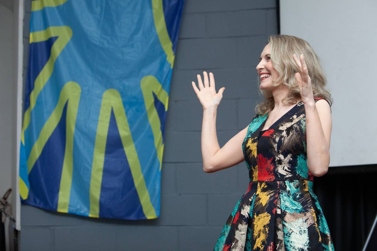 Gerrie is CEO of the Cork Deaf Association. She is pictured above signing at an event. Gerrie is CEO of the Cork Deaf Association. She is pictured above signing at an event.