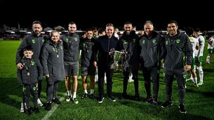 <p>Cork City manager Barry Robson, centre, and staff celebrate with the SSE Airtricity Men’s First Division trophy after the SSE Airtricity Men’s First Division match between Cork City and Finn Harps at Turner's Cross in Cork. Photo by Ben McShane/Sportsfile</p>