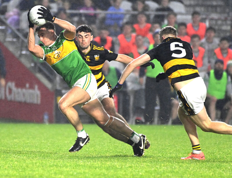 Kilmurry's Kyle Kelleher takes the ball past Buttevant's Donal Ryan and Tadhg O'Connell. Picture: Eddie O'Hare