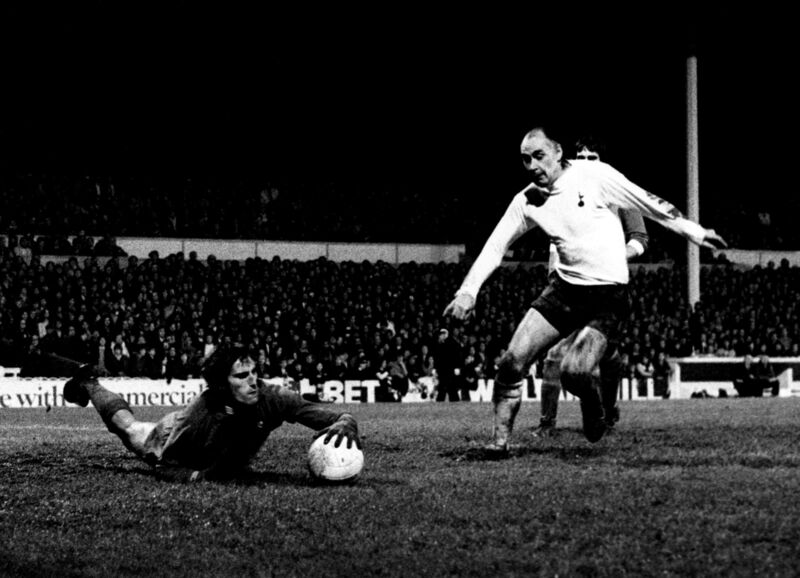 File photo dated 06-01-1972 of Liverpool goalkeeper Ray Clemence dives at the feet of Tottenham Hotspur's Alan Gilzean. PA Photo. Issue date: Sunday November 15, 2020. Former Liverpool, Tottenham and England goalkeeper Ray Clemence has died at the age of 72. See PA story SOCCER Clemence. Photo credit should read PA Wire. File photo dated 06-01-1972 of Liverpool goalkeeper Ray Clemence dives at the feet of Tottenham Hotspur's Alan Gilzean. PA Photo. Issue date: Sunday November 15, 2020. Former Liverpool, Tottenham and England goalkeeper Ray Clemence has died at the age of 72. See PA story SOCCER Clemence. Photo credit should read PA Wire.