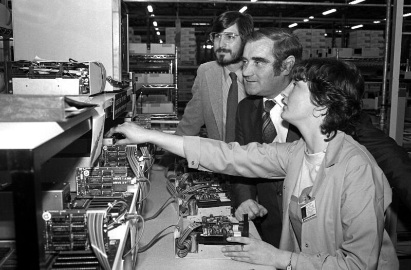 Martina Lyons watched by Minister Gene Fitzgerald and Steve Jobs at the Apple facility at Hollyhill in 1980. Picture: Irish Examiner