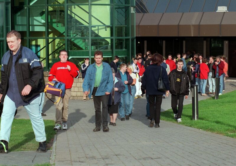 Staff leaving after the day shift at Apple computers, Hollyhill, 1998. Picture: Richard Mills. 