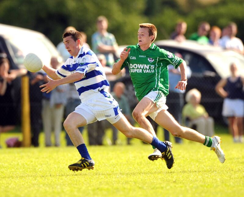 Castlehaven's James Davis racing past Ballincollig's Stephen Carroll. Picture: Eddie O'Hare
