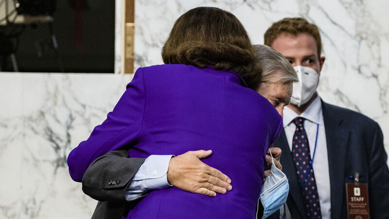 Democratic senator condemned by allies for hugging Republican rival Democratic senator condemned by allies for hugging Republican rival