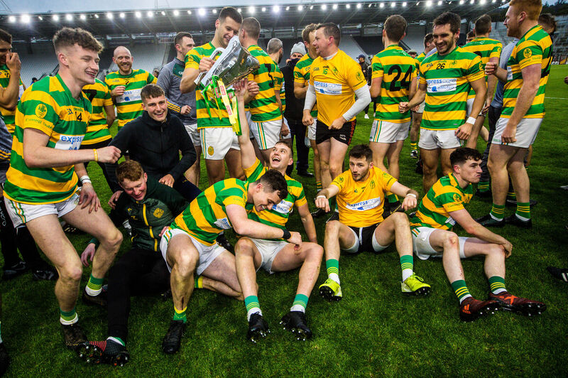 Niall Cashman of Blackrock celebrates with the trophy. Picture: INPHO/Ryan Byrne