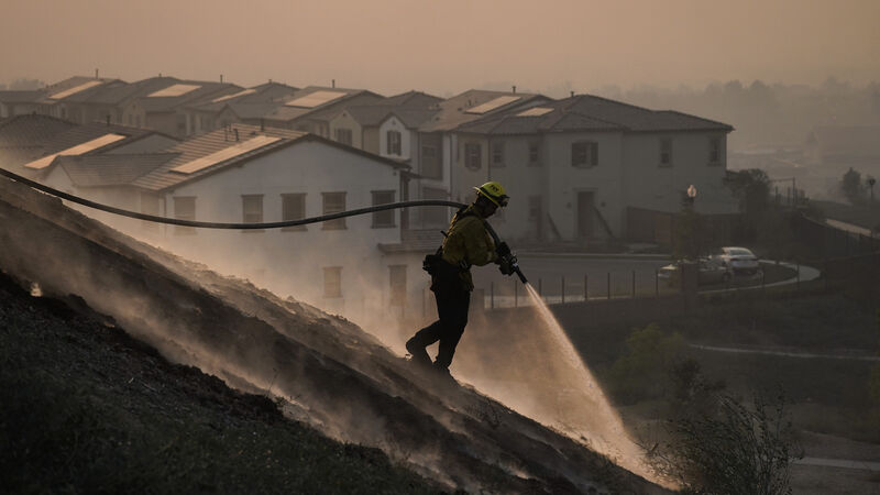 Tens of thousands evacuated as crews battle California wildfires Tens of thousands evacuated as crews battle California wildfires