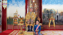 Thailand’s king reconciles with ousted consort