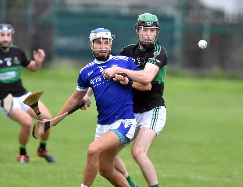 Nemo Rangers' Barry Cripps and Brian Dillon's Tomás Lawrence tussle for the sliotar at Ballinlough. Picture: Eddie O'Hare