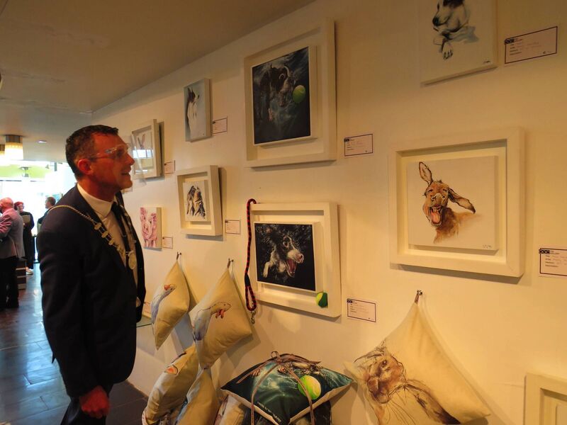 Cllr Liam O'Connor, viewing the Owenabue Arts Collective Cllr Liam O'Connor, viewing the Owenabue Arts Collective