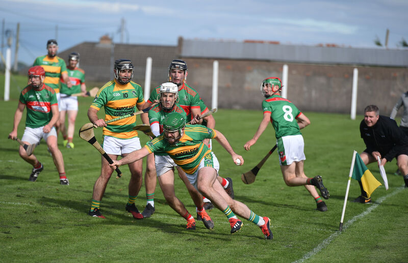 A determined Eoin Healy, Ballymartle, battles to keep possession against Fr O'Neill's. Picture: Larry Cummins. A determined Eoin Healy, Ballymartle, battles to keep possession against Fr O'Neill's. Picture: Larry Cummins.