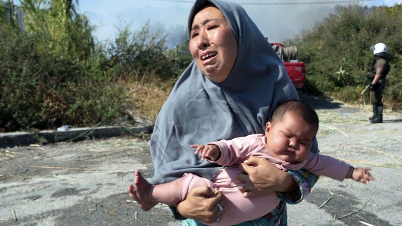 Thousands still homeless after Greek refugee camp fire Thousands still homeless after Greek refugee camp fire