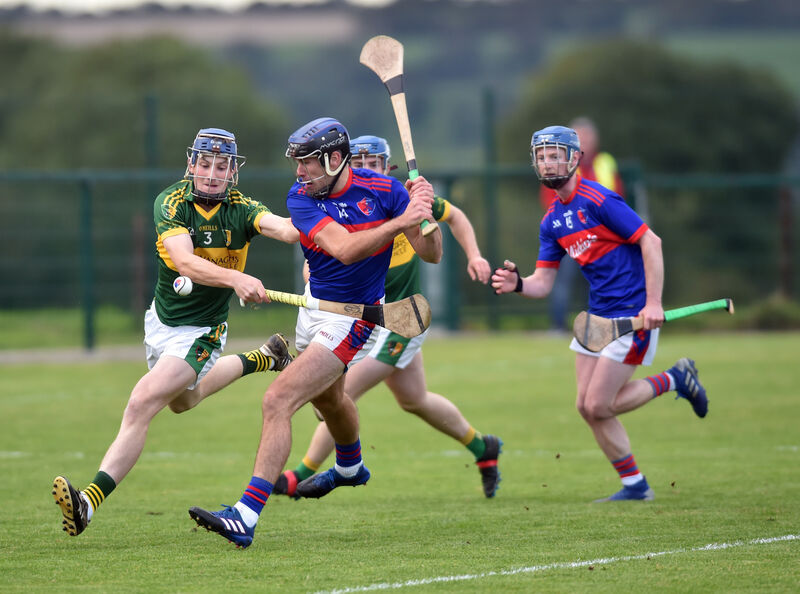 Erin's Owns' Mossie O'Carroll shoots from Newtown's Kieran O'Sullivan. Picture: Eddie O'Hare Erin's Owns' Mossie O'Carroll shoots from Newtown's Kieran O'Sullivan. Picture: Eddie O'Hare