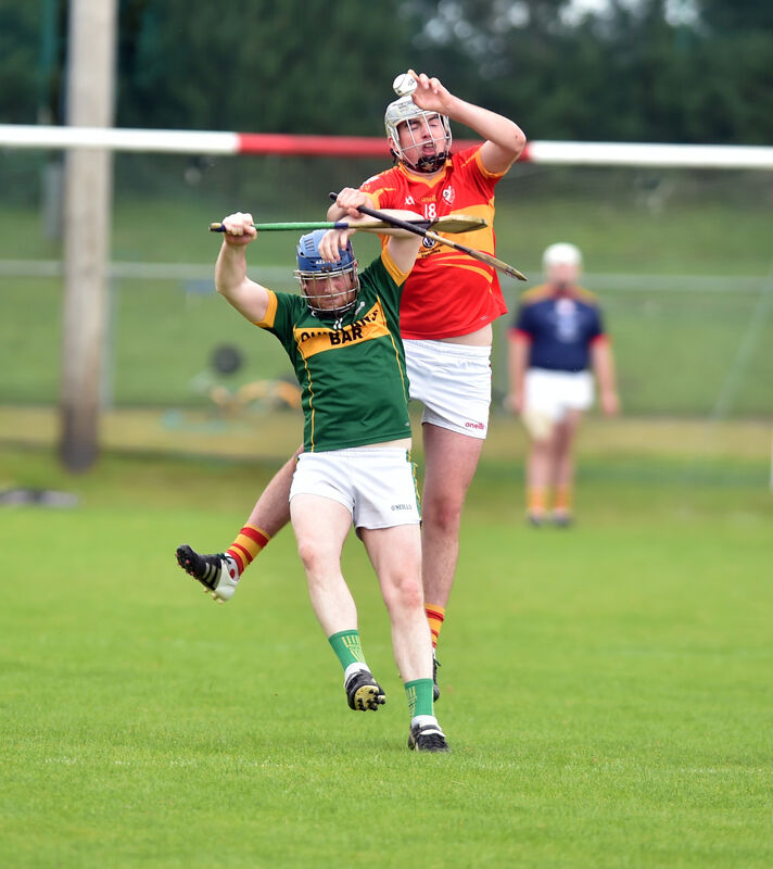 Éire Óg's Mark Kelleher goes highest to win the sliotar from Meelin's Liam Collins.Picture: Eddie O'Hare Éire Óg's Mark Kelleher goes highest to win the sliotar from Meelin's Liam Collins.Picture: Eddie O'Hare
