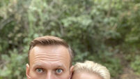 Russian opposition leader Alexei Navalny visited by Angela Merkel in hospital