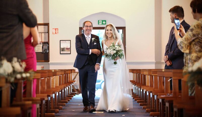 ARM IN ARM: Louise Casey with her dad Jerry Casey walking her up the aisle.