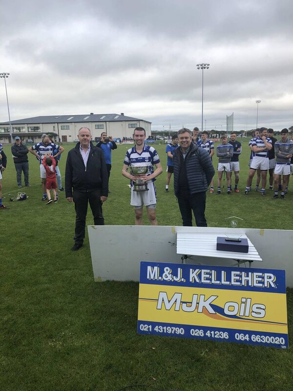 Inniscarra captain Donal O Callaghan with the cup after it was presented to him by Gerard Kelleher of MJK Oils. Inniscarra captain Donal O Callaghan with the cup after it was presented to him by Gerard Kelleher of MJK Oils.