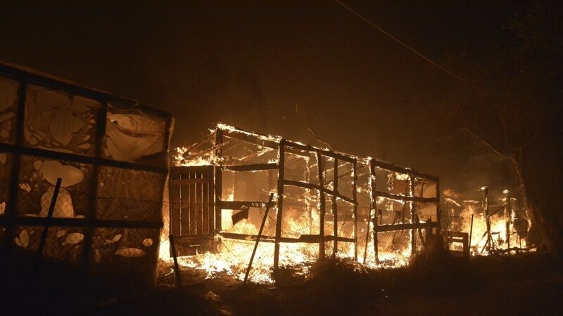 Thousands flee fire at migrant camp on coronavirus lockdown in Greece Thousands flee fire at migrant camp on coronavirus lockdown in Greece