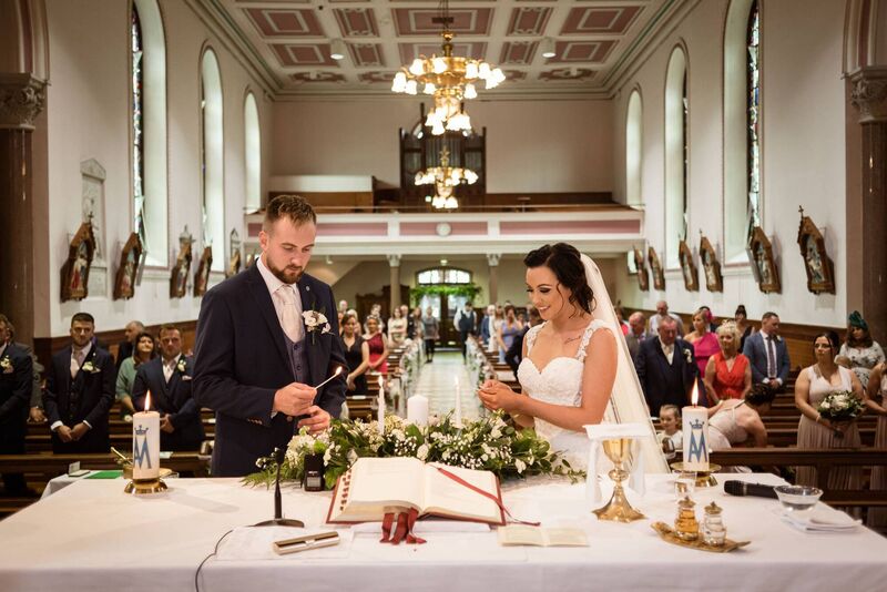 Catherina and Jason lighting a candle. Catherina and Jason lighting a candle.