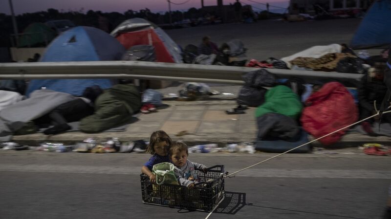 Thousands sleep in open after Greek refugee camp burns down Thousands sleep in open after Greek refugee camp burns down