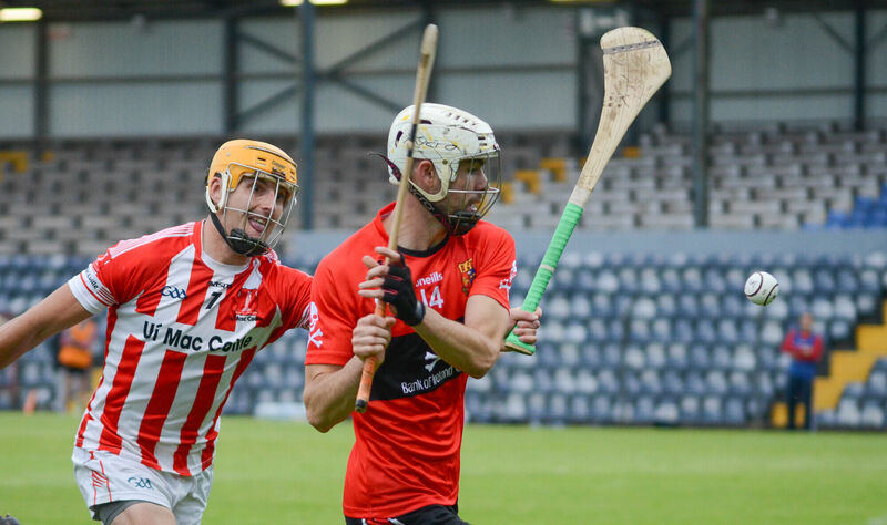 UCC's Brian Verling about to strike the sliotar upfield despite the attention of Imokilly's John Cronin. Picture: Howard Crowdy UCC's Brian Verling about to strike the sliotar upfield despite the attention of Imokilly's John Cronin. Picture: Howard Crowdy