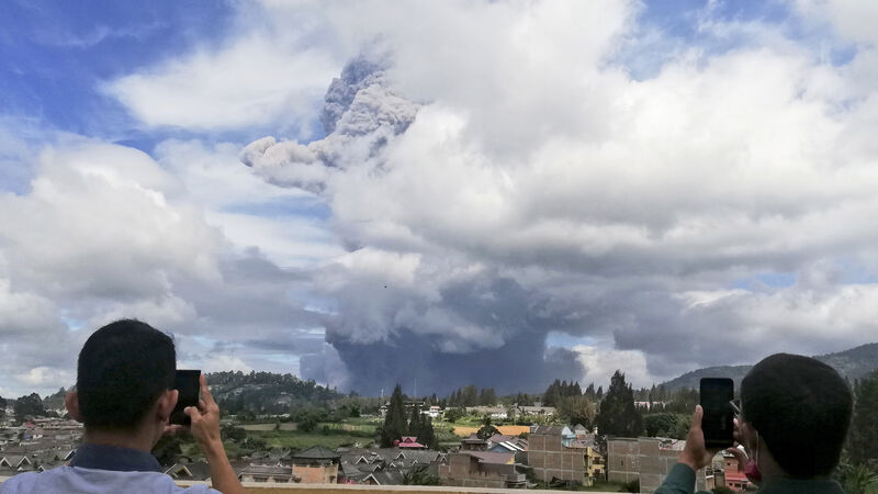Warning after Indonesian volcano spews column of ash