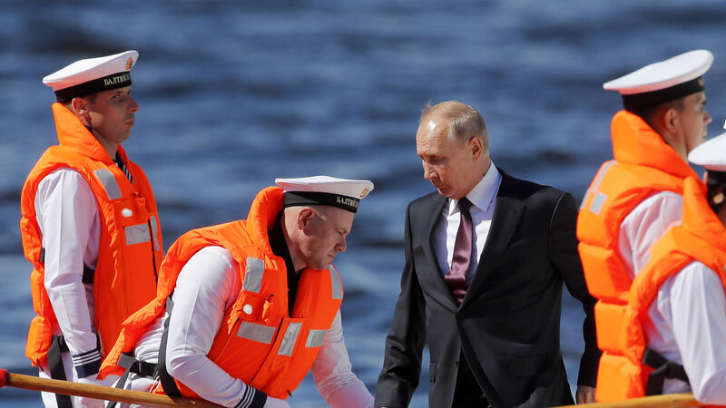 Putin attends naval parade and promises new ships
