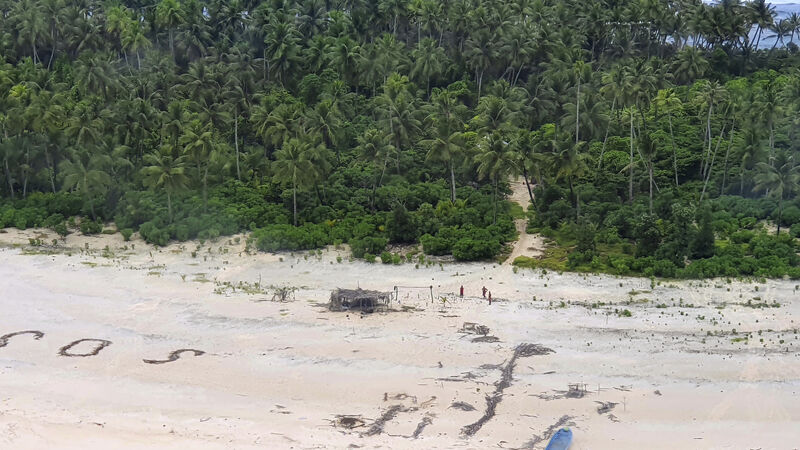 Men rescued from uninhabited Pacific island after writing SOS in sand Men rescued from uninhabited Pacific island after writing SOS in sand