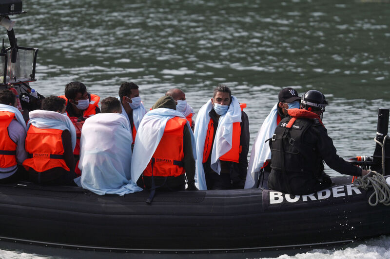 A group of people thought to be migrants are brought into Dover, Kent, by Border Force officers following a number of small boat incidents in the Channel. Photo: Steve Parsons/PA Wire