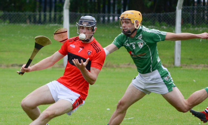 Cloyne's Jack Hallihan juggles with the sliotar despite the challenge from Killeagh's Sean Long. Picture: Howard Crowdy