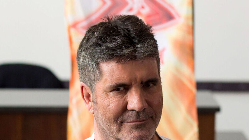 Simon Cowell breaks back while testing electric bike Simon Cowell breaks back while testing electric bike