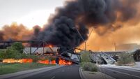 Arizona train derailment causes bridge collapse and fire