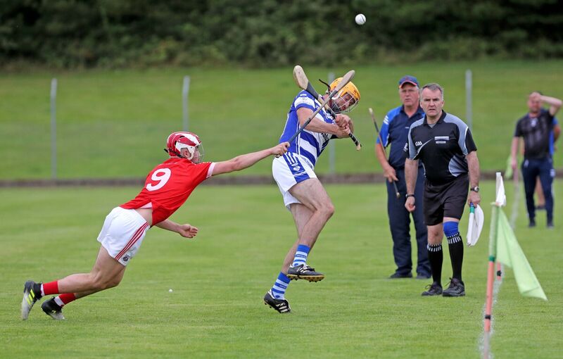 Stephen Olden, Inniscarra, clears from Patrick Crowley, Blarney. Picture: Jim Coughlan.