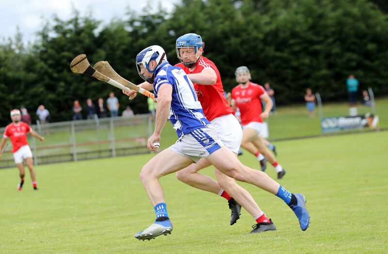 Seán O'Donoghue, Inniscarra, takes on Joe Jordan, Blarney. Picture: Jim Coughlan.