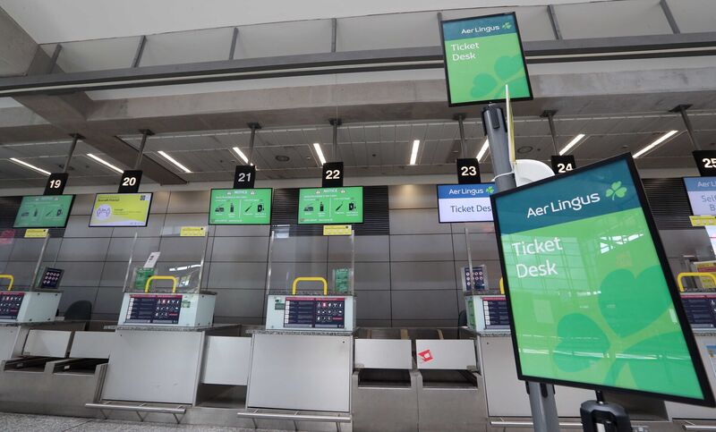 An empty check-in desk at Cork Airport An empty check-in desk at Cork Airport