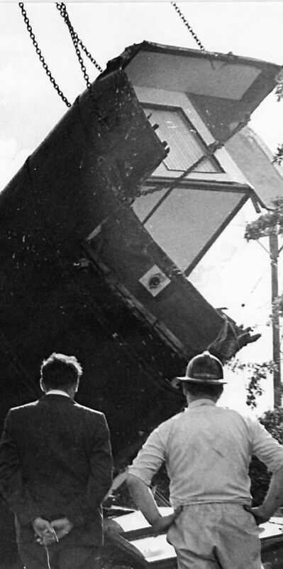COMMUNITY IN SHOCK: Two people surveying the wreckage of the derailment