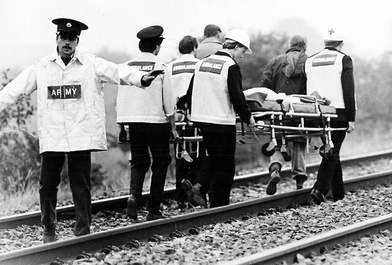 An injured casualty is taken away