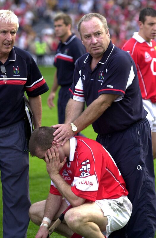 Seanie O'Leary comforts Ben O'Connor after losing to Kilkenny in 2003. Picture: Brian Lougheed