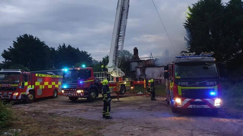 Latest: Cork City Fire Service use aerial platform as they continue to battle house fire 