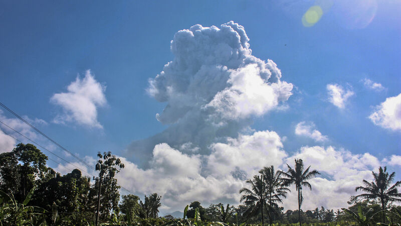 Indonesia’s most active volcano spews ash and gas into sky