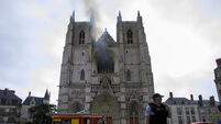 Arson inquiry launched as French firefighters battle blaze in Nantes cathedral