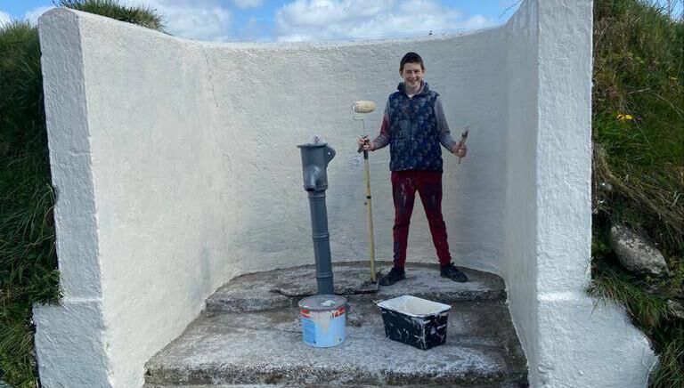 Conor McLoughlin hard at work repainting a local water pump in Donoughmore. Conor McLoughlin hard at work repainting a local water pump in Donoughmore.