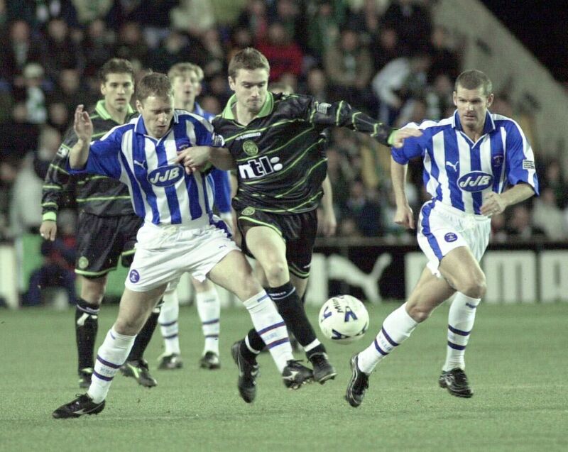 Kilmarnock Mark Reilly left and Ian Durrant battle Celtic's Colin Healy in 2000. Picture: David Cheskin