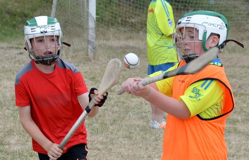 This year's Ballincollig Cúl Camp has been called off. Kaden Coomey, right, hurling with Cal McCarthy. Picture: Denis Minihane.