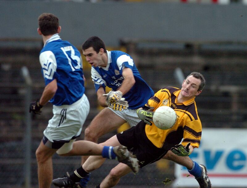 St Mary's John Caulfield gathers the ball from Rathpeacon's Brendan Hallissey during the 2004 junior B county football final. Picture: Eddie O'Hare