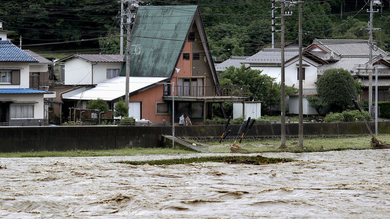 Japan battered by more heavy rain as floods death toll nears 60