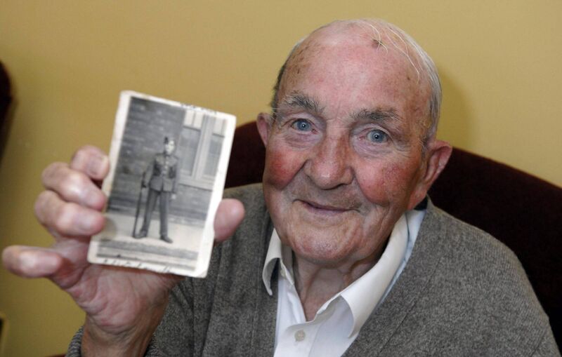 The late Paddy Martin, father of Micheál Martin with a photograph when he was a young man in the army in 1940 