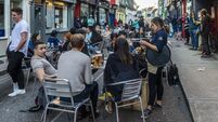 Cork bar owner: 'We are not taking any crap. Our customers just want to get back on our stools'