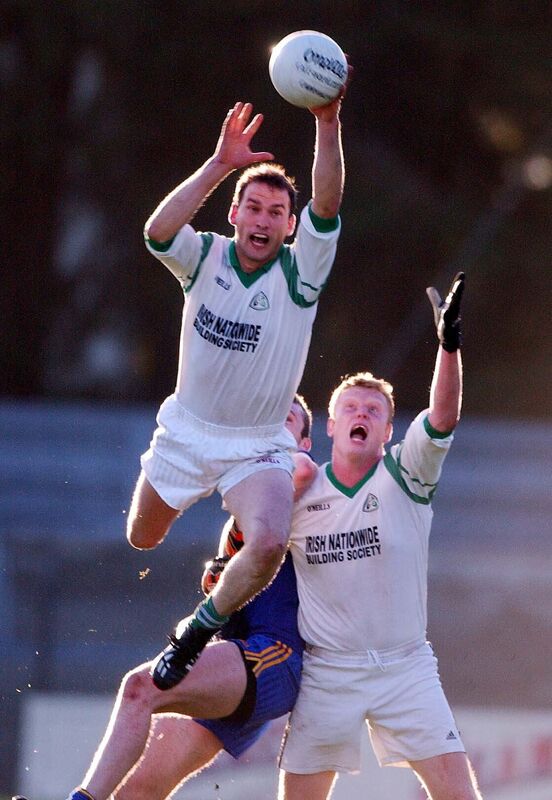 Ilen Rovers midfielder Factna Collins watched by team mate Alec Whooley first to the ball ahead of Carrigaline's Nicholas Murphy in the Cork County IFC final. Picture: Des Barry